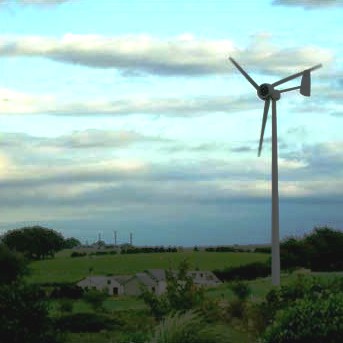 A wind turbine in a rural hamlet wind power